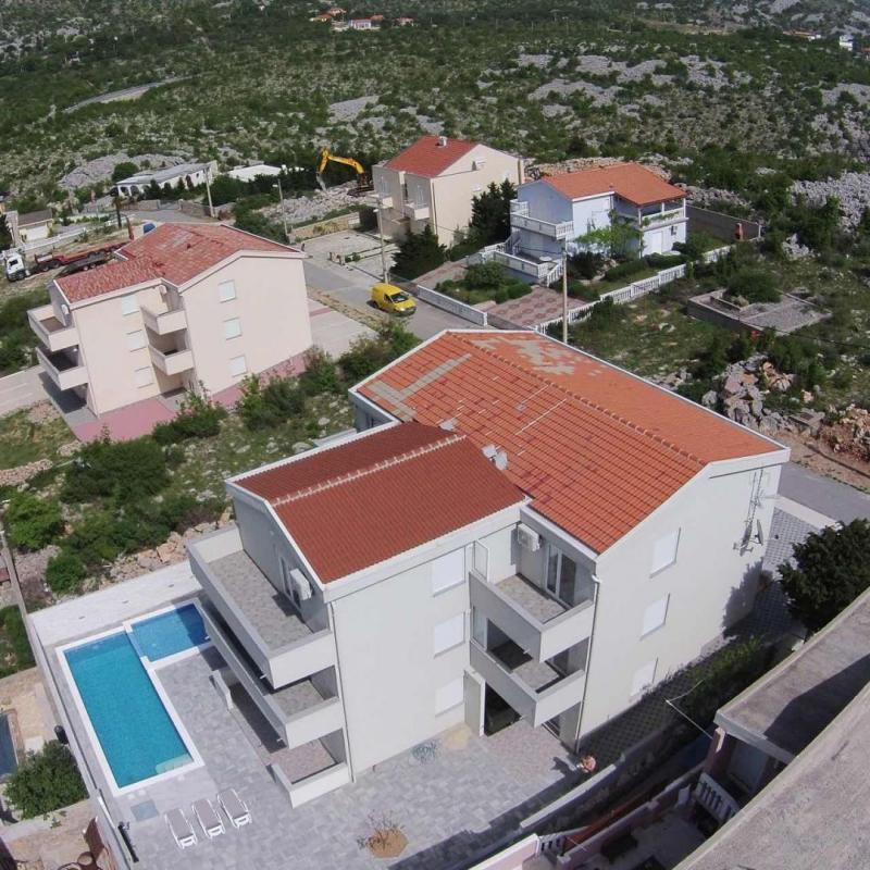House with 9 apartments in Cesarica, Karlobag 150 meters from the sea 