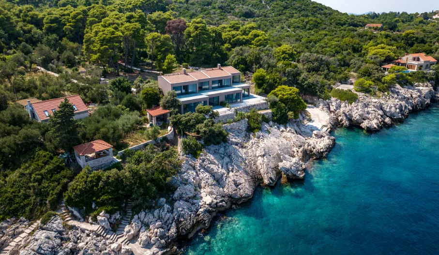 Two modern villas on an isolated island near Dubrovnik which can be united into a single villa with 422 m2 surface and 5656 m2 land plot 