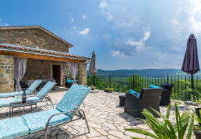 Two stone properties with a swimming pool in Oprtalj with a view of Motovun 