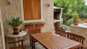 Apartment with wonderful garden in Postira on Brac island 150 meters from the sea 