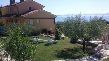 Two houses with apartments on a spacious garden 2000 m2 with sea view just 600 meters from the sea in Drenje 