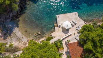 Unique villa on the first line to the sea near city of Hvar, with private beach and private pier 