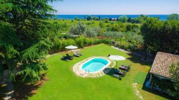 Beautiful villa in Umag outskirts just 250 meters from the sea across green lawns 