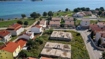Investment project - land plot with valid building permit and finished basement just 80 meters from the sea 