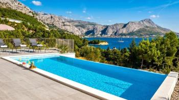 Marvellous new modern villa on Omis riviera just 60 meters from the sea, with swimming pool, sauna, fitness studio and garage 