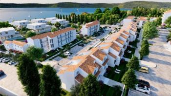 One-bedroom apartment with a garden in a luxury resort 100 m from the sea near Zadar! 