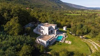 Secluded villa surrounded by nature and spacious land of 14100 sq.m. in Rabac-Labin area 