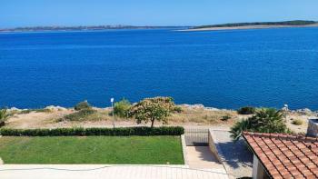 Three- bedroom apartment in a new building on Pag peninsula in Povljana, 1st row to the sea 