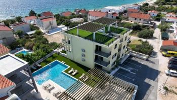 Neue Wohnungen in Sevid in exklusiver Residenz mit Pool am Meer, 100 m vom Strand entfernt 