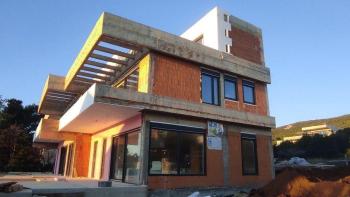 Two modern houses under construction in the second row to the sea in Stara Novalja, Pag 