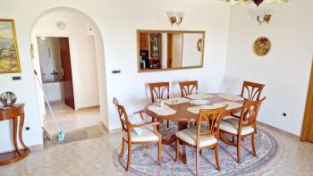 Two-bedroom apartment with small garden, summer kitchen and parking space 