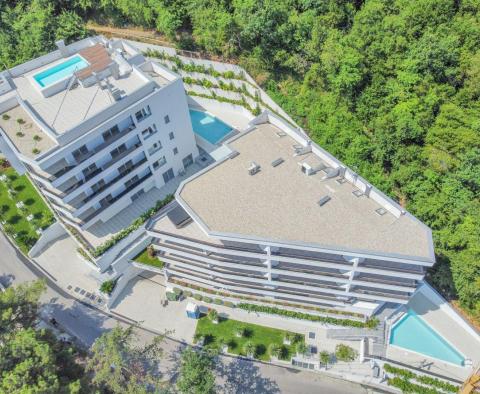 Beautiful apartment in a new building with a sea view, shared pool, garage in Opatija - pic 4