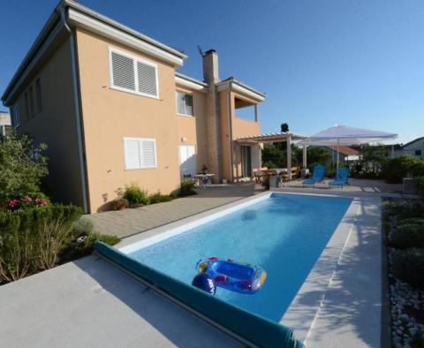 Nice villa of two apartments just 100 meters from the sea in popular and friendly Petrcane! 