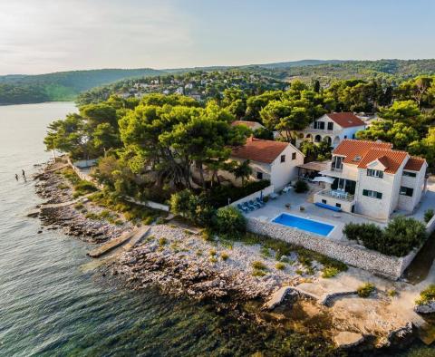 Beachfront villa decorated with traditional stone, with swimming pool, on magic Brac island  