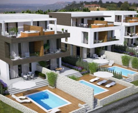 Two bedroom apartment with a swimming pool in an urban villa on Pag peninsula 