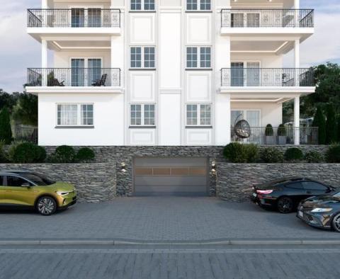Larger apartment in a new building with a swimming pool, garages and a sea view near the beach and Opatija (Icici) 
