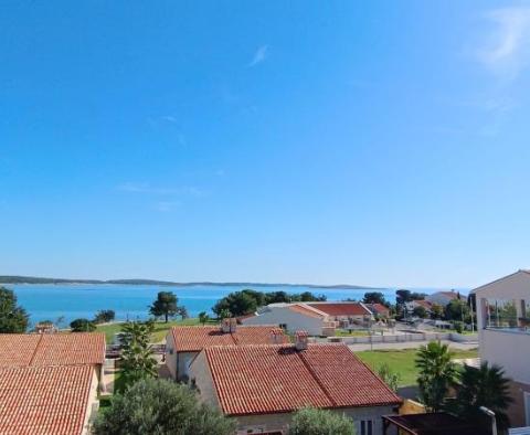 Beautiful apartment with a terrace and a view in a new building 100 meters from the sea in Medulin - pic 10