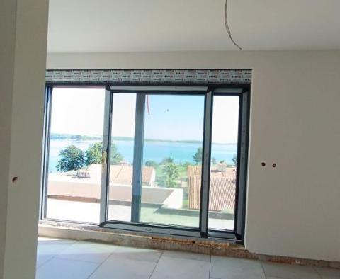 Apartment on the ground floor of a new building 100 meters from the beach, view, terrace, parking - popular Medulin - pic 21