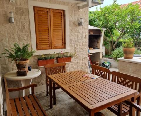 Apartment with wonderful garden in Postira on Brac island 150 meters from the sea 