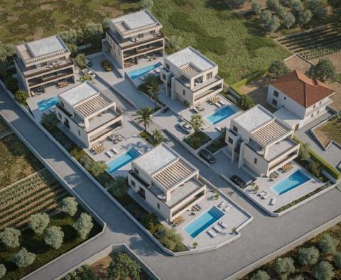 Unique urban land with ready building permits for 6 luxury villas in Trogir area 