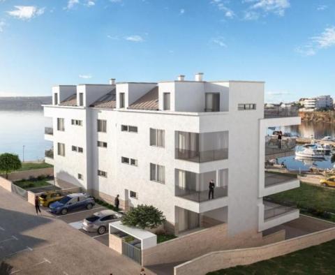 Apartment with 2 bedrooms on the 1st line to the sea in a modern high end residence in Povljana, Pag 
