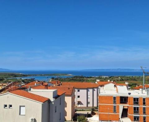 Two-story apartment with a panoramic sea view in Liznjan 