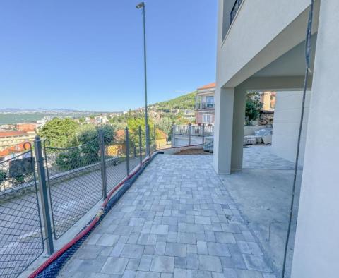 Apartment with a garden in a new building in the center of Opatija with a garage, sea view - pic 12