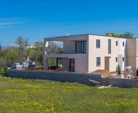 Two newly built semi-detached houses with one swimming pool, package sale 