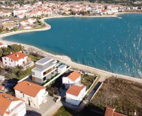 Luxury villa on the first row to the sea in Zadar area, high-tech beauty under construction 