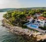 Beachfront villa decorated with traditional stone, with swimming pool, on magic Brac island  