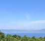 Spacious urban land plot with building permit and sea views in Rabac area 