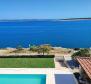 Three- bedroom apartment in a new building on Pag peninsula in Povljana, 1st row to the sea 