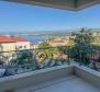 Highest quality apartment of 67m2 in a new building in the center of Opatija with garage, sea view, 200 meters from the beach 