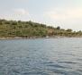 Larger part of a green island within beautiful Kornati archipelago 