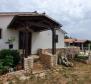 Two houses in a spacious garden with great investment potential in Rakalj 