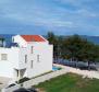 Belle villa d'un emplacement unique au premier rang de la mer dans la région de Zadar 