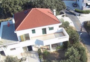 A solid detached three apartment house with terraces and garden in Trogir outskirts 